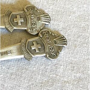 Rolex stainless steel souvenir, spoons.